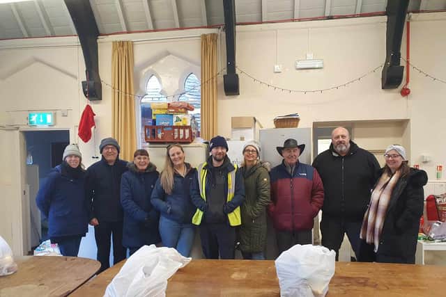 The Bread & Butter Thing's area manager for the East Midlands, Nate McDowall (centre) with his army of trained volunteers at Thorney Community Centre. "We're always looking for more volunteers."