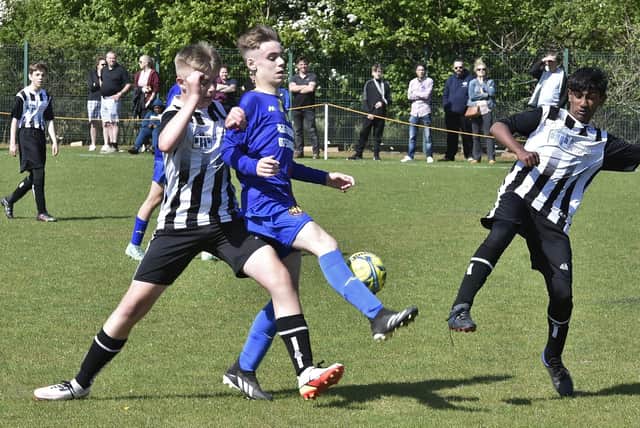 Action from Parkside Under 14s v South Lincs Swifts (stripes). Photo: David Lowndes.