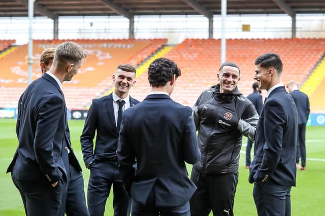 Former Peterborough United player Oliver Norburn, now of Blackpool, catches up with former team-mates before yesterday's game. Photo: Joe Dent/theposh.com.
