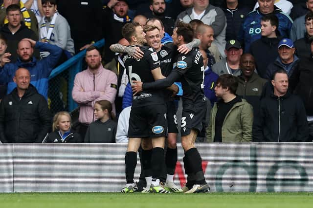 Sammie Szmodics (centre) celebrates his goal for Blackburn at Leeds. Photo by Ed Sykes/Getty Images.