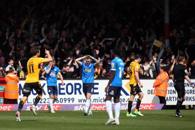 Cambridge United celebrate as Posh suffer in a League One clash in April. Photo: Joe Dent/theposh.com.