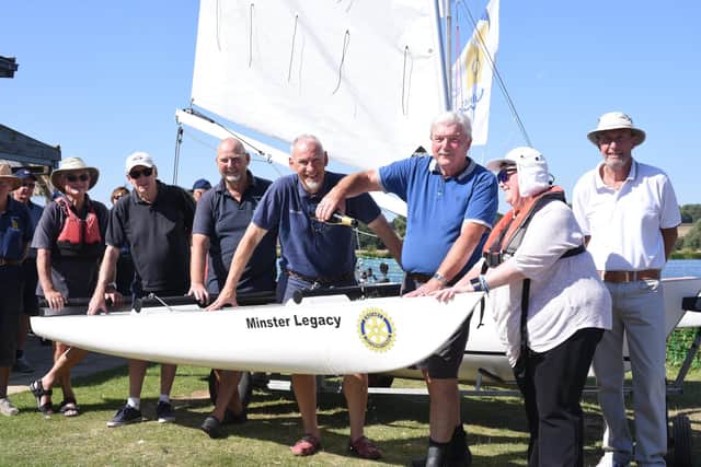 Launch of a new Challenger tri-maran at Peterborough Sailability with funds donated by Peterborough Minster Rotary of £6,300 . Pictured are Rotary past president Dr John Hastie, Sailability secretary Richard Dykes and disabled sailor Lily Hewitt