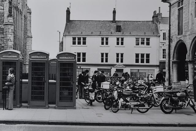 Cathedral Square - when the gap between St John's Church and The Guildhall was a popular parking spot for motorcyclists. What happened to all the phones boxes?