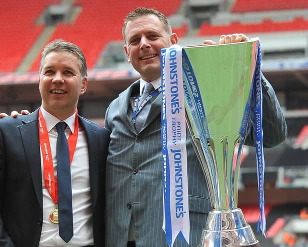 Posh manager Darren Ferguson (left) and chairman Darragh MacAnthony with the Johnstone's Paint Trophy. Photo: David Lowndes.