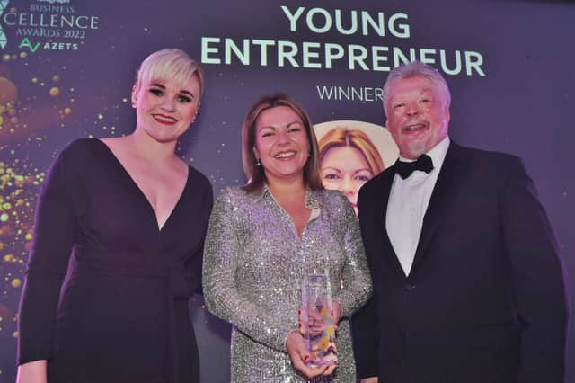 Peterborough Telegraph Business Excellence Awards 2022.  Young Entrepreneur of the Year winner Laura Wilson, centre, with sponsor Ashley Sutherland of Hegarty Solicitors,  and guest speaker Simon Weston.
