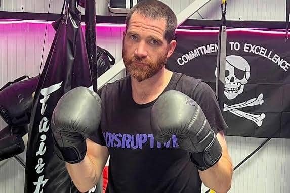 Entrepreneur Rob Moore takes aim ahead of a charity boxing fight.