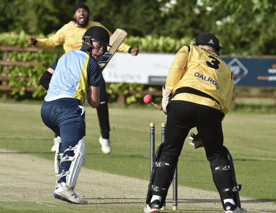 Mark Saunders of Burghley Park is bowled by Peterborough Town's Karanpal Singh in the Stamford Shield Final. Photo: David Lowndes.