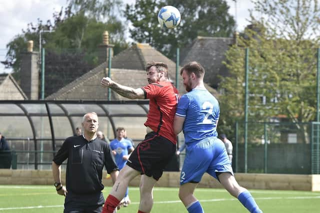 Action from Netherton United (red) v Warboys Town at the Grange. Photo David Lowndes.