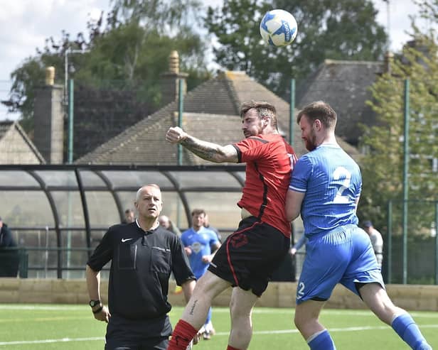 Action from Netherton United (red) v Warboys Town at the Grange. Photo David Lowndes.