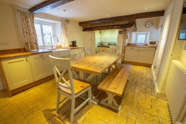 The property has many period features including exposed beams and stone work