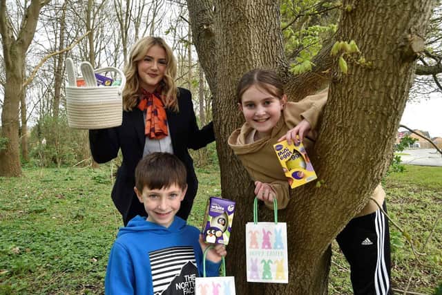Jake and Isabel Hall with Bellway Sales Advisor Katie Brown at the Easter Egg Hunt in Peterborough