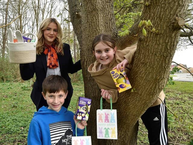 Jake and Isabel Hall with Bellway Sales Advisor Katie Brown at the Easter Egg Hunt in Peterborough