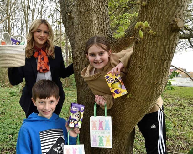 Jake and Isabel Hall with Bellway Sales Advisor Katie Brown at the Easter Egg Hunt in Peterborough