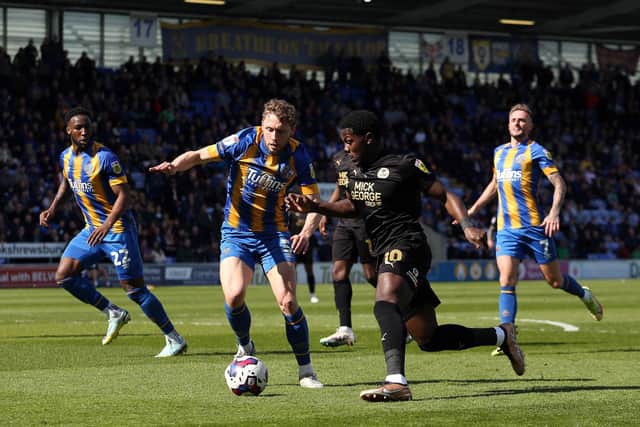 Ephron Mason-Clark of Peterborough United takes on Matthew Pennington of Shrewsbury Town. Photo: Joe Dent.
