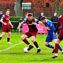 James Hill-Seekings (on ball) scored twice for Bourne Town against Dunkirk. Photo: Dave Mears.