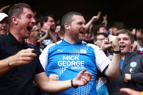 A Peterborough United fan celebrates after their first goal at last season.