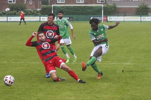 Domingos Sanha shoots at goal for FC Peterborough against Framlingham. Photo: Tim Symonds.