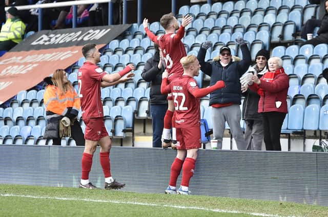 Alfie May (centre) after scoring at Posh earlier this month. Photo: David Lowndes.