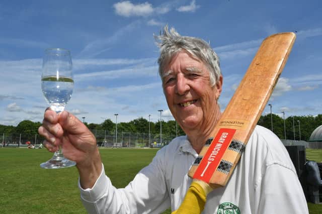 Norman Gray toasts his 1,000th game for Castor CC. Photo: David Lowndes.