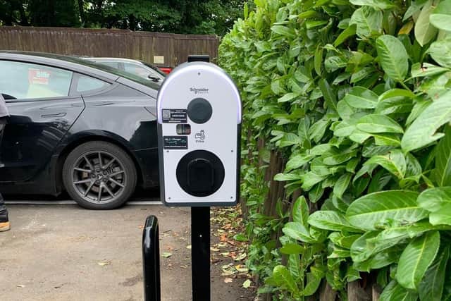 Our chargers in a parking space near the green.