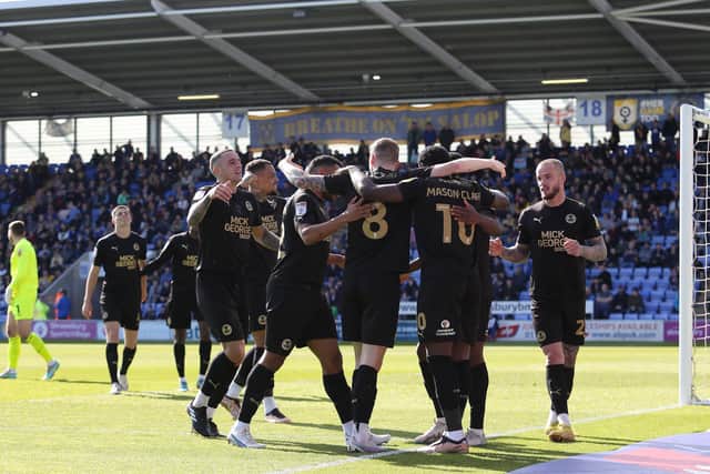 Peterborough United players celebrate the second goal at Shrewsbury. Photo: Joe Dent/theposh.com.