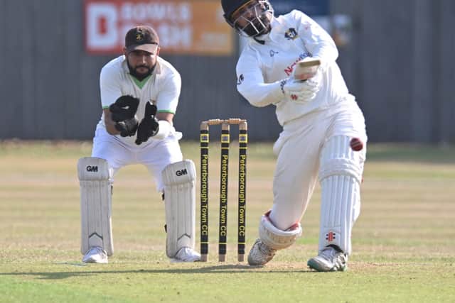 Zeeshan Manzoor hits out for Peterborough Town against Barnack. Photo David Lowndes.