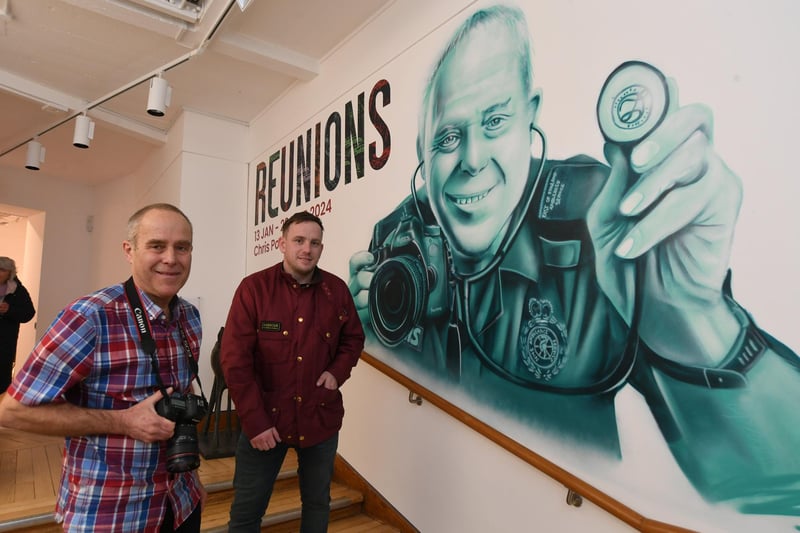 Chris Porsz with the specially commissioned mural of him created by street artist Nathan 'Nyces' Murdoch at Peterborough Museum.
