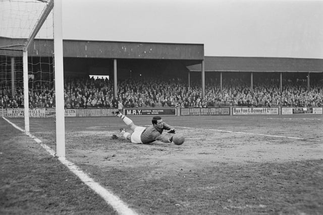 Posh keeper Willie Duff is pictured making a save during a match between Walsall FC and Peterborough United at Fellows Park Stadium in Walsall on 1st March 1965.