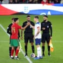 England captain Ronnie Edwards at the pre-match coin toss with his Portugal counterpart at stadium:mk. Photo: Joe Dent/theposh.com.