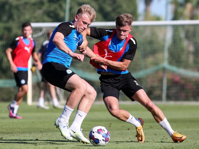 Joe Taylor battles with Joe Tomlinson during a training match.