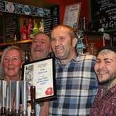 From left, Sue Minto, landlady, Alan Edwards, manager, Graham Finding, landlord, David Reeve-Shillito, manager and Dickie Bird, Branch Secretary Peterborough CAMRA at the presentation of the CAMRA Best City Pub award.