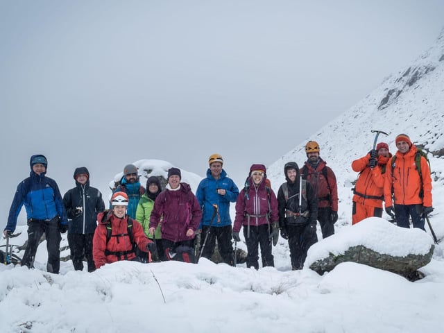 The PMC Winter Skills course. From left to right: Dominik, Helen, Mark, Jules, Angharad, Elisabeth, Craig, Melissa, Daniel Grammatica, Rick and the two Plas-Y-Brenin instructors. Picture taken in the Nameless Cwm on Glyder Fawr.