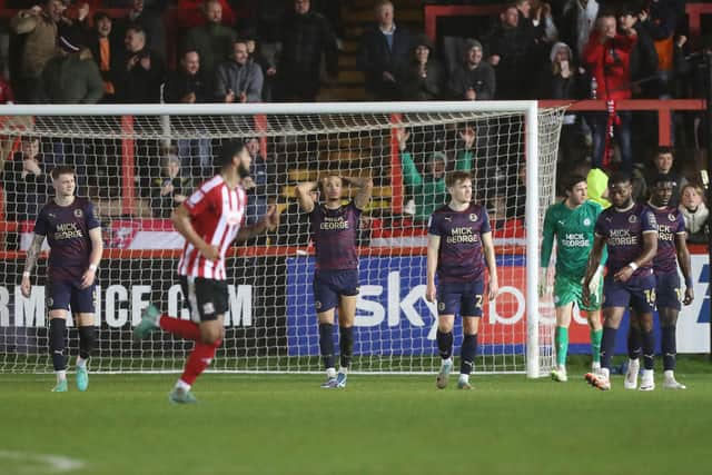 Posh defender Jadel Katongo (hands on head) after his own goal at Exeter. Photo: Joe Dent/theposh.com