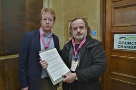 Paul Bristow MP with Dale McKean handing in a petition to full council to save the Eye library site
