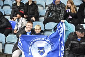Peterborough United fans watch their side struggle to a 2-2 draw at home to Salford.