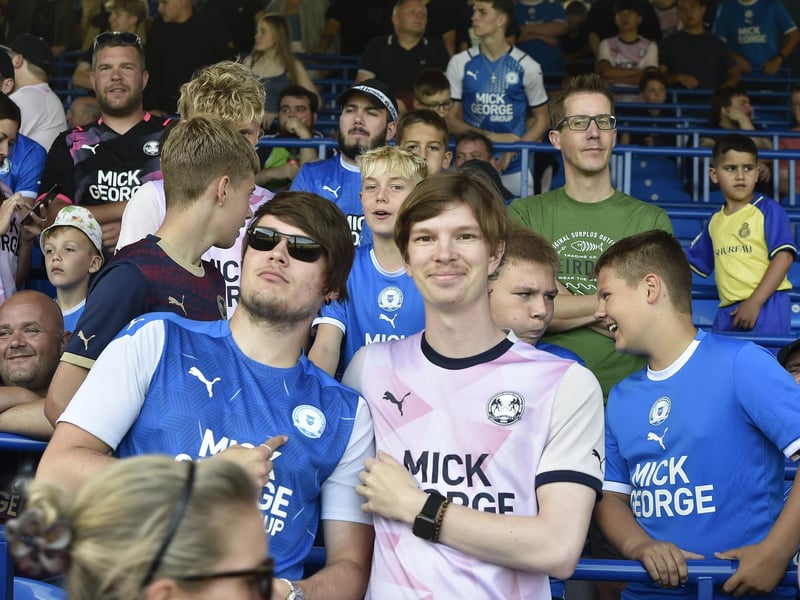 Peterborough United fans watch the draw with Leyton Orient.