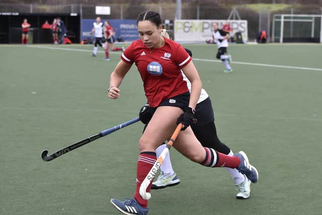 City of Peterborough Ladies player-of-the-year Tierney Augustine (red).