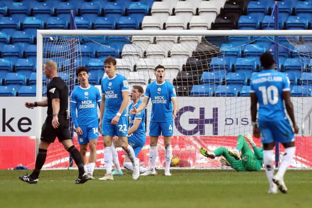 Peterborough United players react after conceding the second goal against Wigan. Photo: Joe Dent/theposh.com.