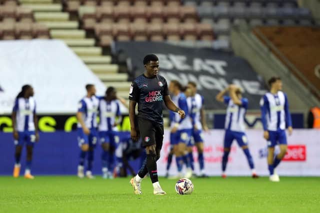 Kwame Poku looks dejected as Posh concede the third goal against Wigan. Photo: Joe Dent.