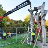 Contractors pictured removing Peterborough Arch sculpture in Thorpe Meadows for restoration.