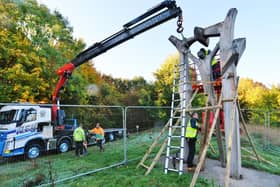 Contractors pictured removing Peterborough Arch sculpture in Thorpe Meadows for restoration.