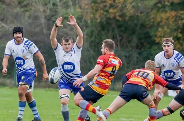 Charles Pendlebury of Peterborough Lions tries to block a clearance from Borough scrum half Ross Chamberlain. Photo: Mick Sutterby.