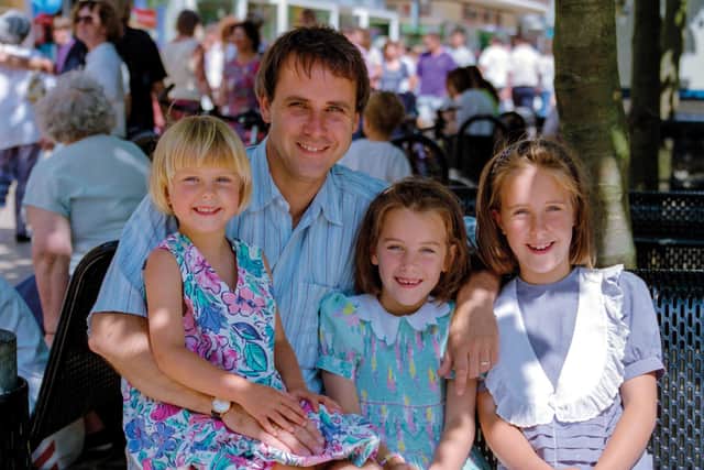 The 1994 photo of Dr Richard Scott and his three daughters.