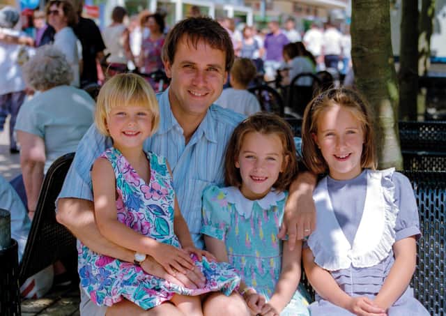 The 1994 photo of Dr Richard Scott and his three daughters.