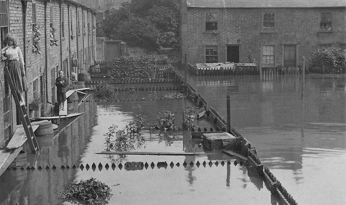 The flooded Nene washed out many of the properties in Bodgers Yard, the area we now know as Rivergate. Today this photo would be sited adjacent to the main entrance to the Asda Superstore (Peterborough Images Archive)