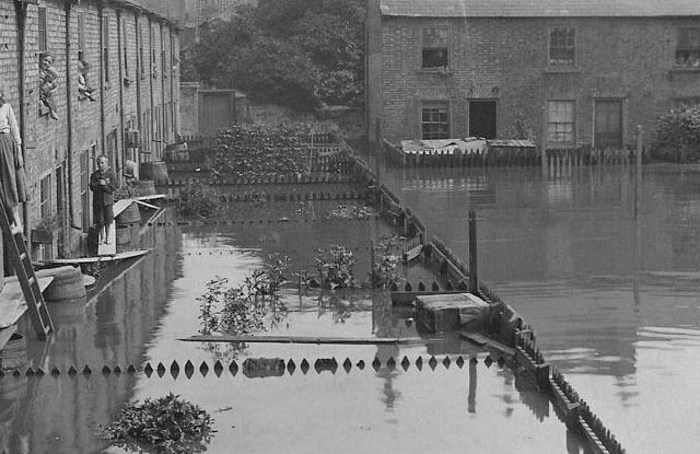 The flooded Nene washed out many of the properties in Bodgers Yard, the area we now know as Rivergate. Today this photo would be sited adjacent to the main entrance to the Asda Superstore (Peterborough Images Archive)