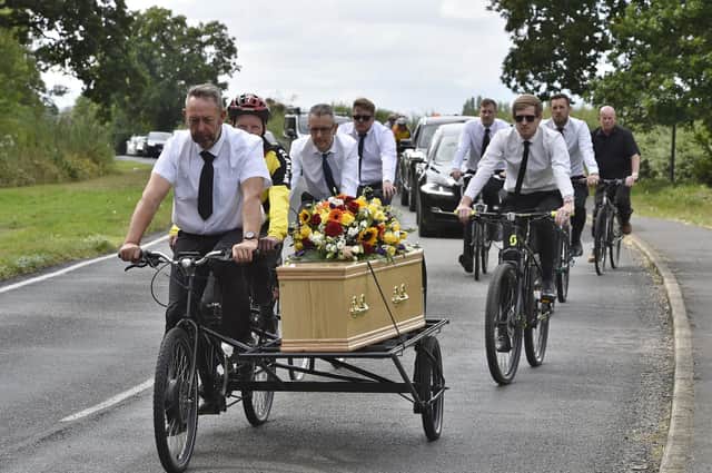 A specially converted tandem is used to bring the coffin of Raymond Pitchford to Peterborough Crematorium.
