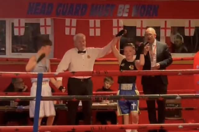 Henry Doe (right) is declared the winner of his first competitive fight