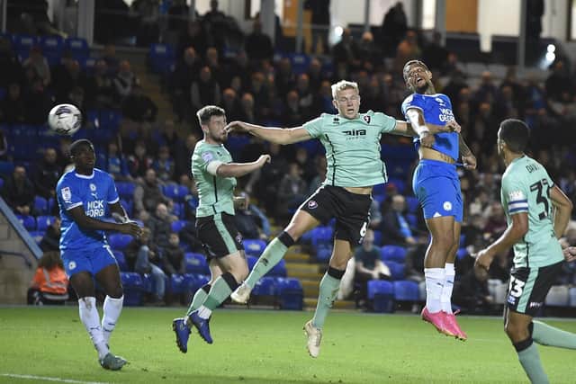 Jonson Clarke-Harris heads at goal for Peterborough United. Photo: Joe Dent.