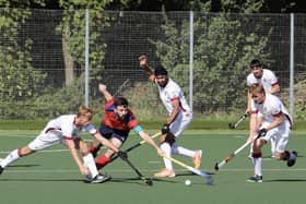 City of Peterborough captain Ben Newman (red) in action against Barford Tigers. Photo Andy Dann.